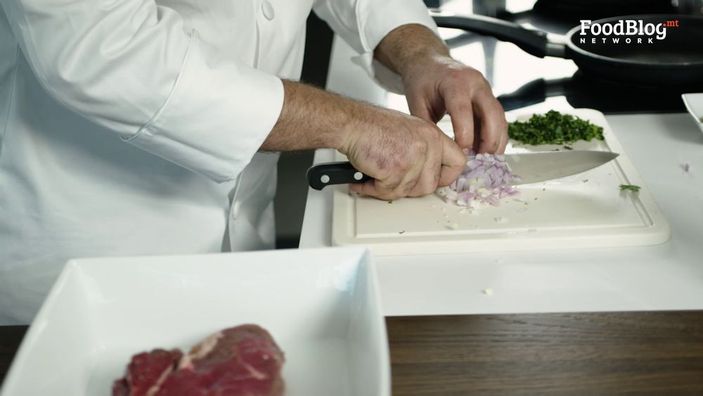 Marvin Gauci chopping onions for the stilton sauce from FoodBlog Marvin's Five