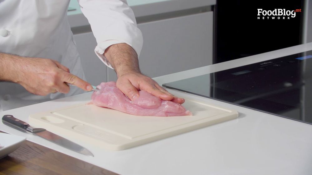 Use a sharp knife to create a pocket in your turkey breast.