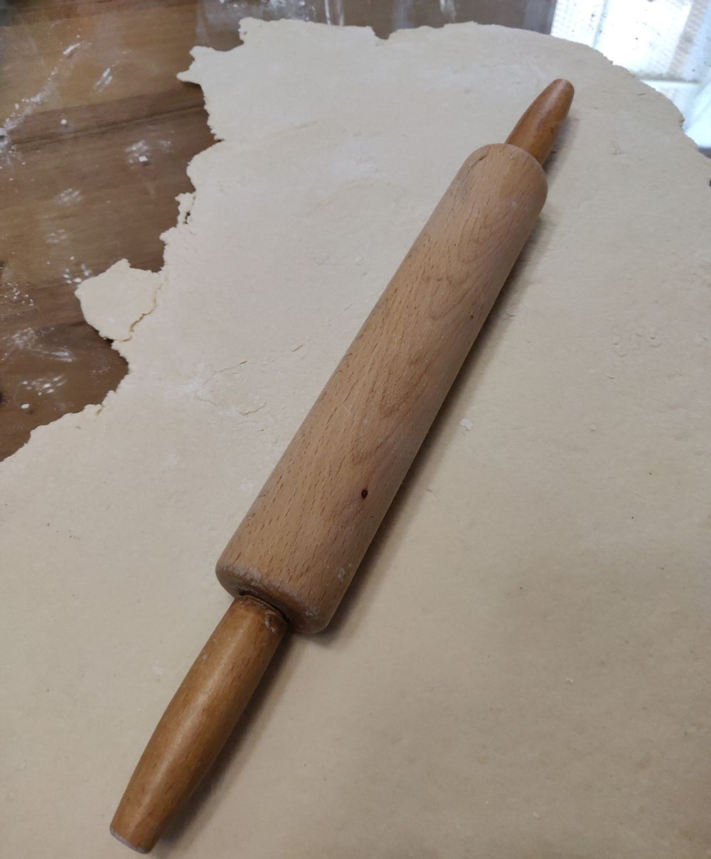Rolling pin and ravioli dough.