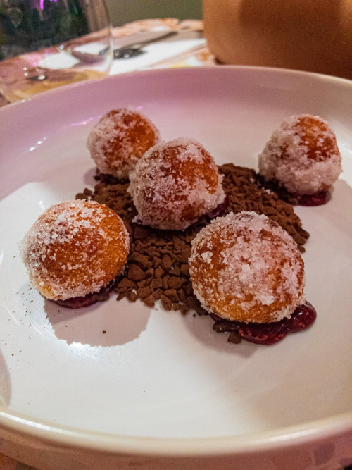 Fresh ricotta and orange fritters on bed of chocolate from Barbajean Malta