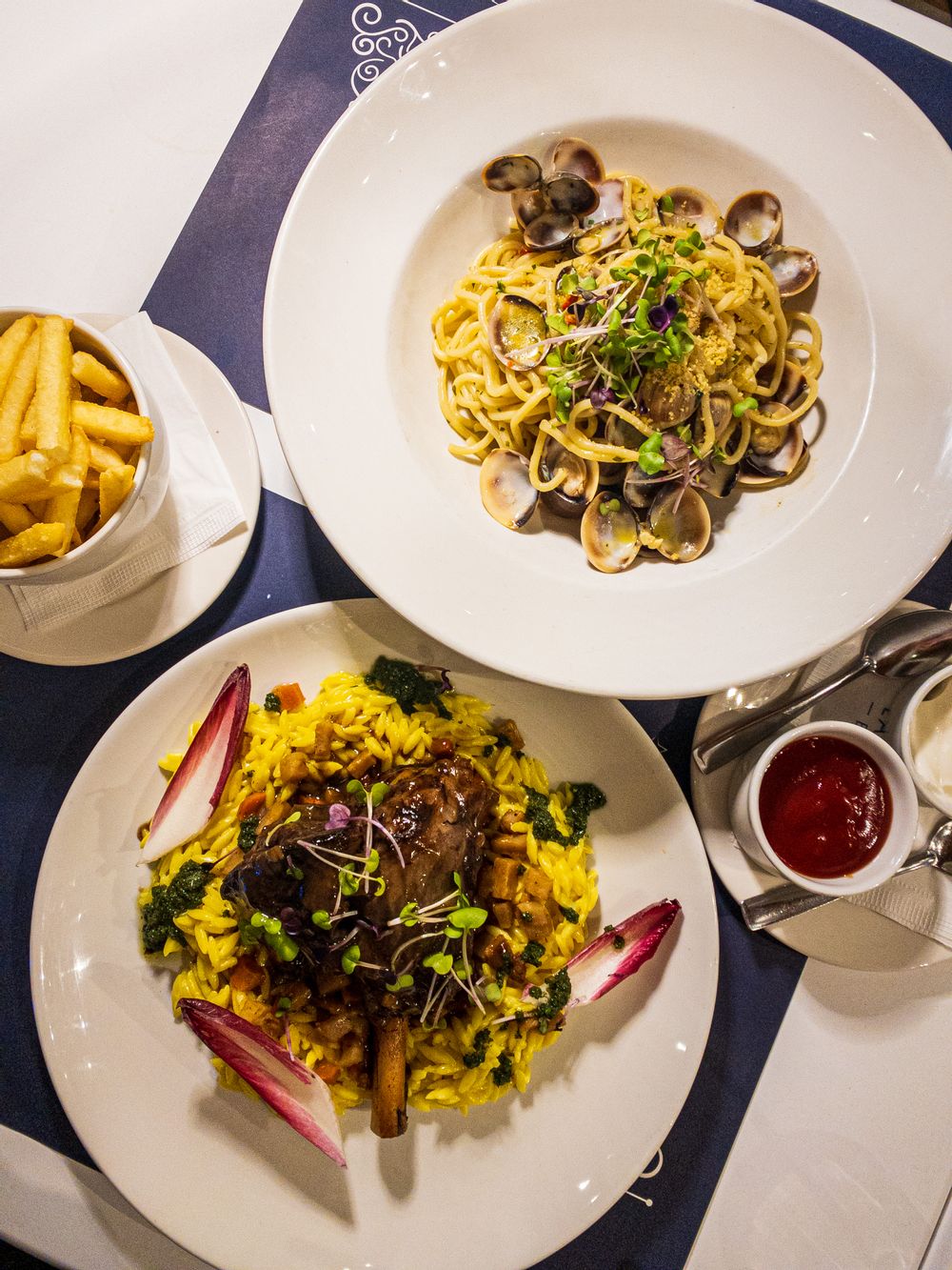 spaghetti vongole and braised lamb shank served at la nave restaurant qawra malta
