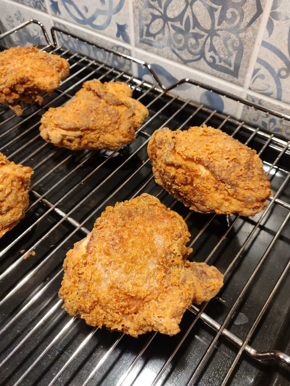 Fried chicken ready to be finished off in the oven 