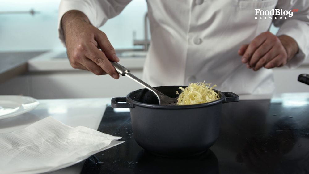 Marvin Gauci removing the fried potatoes form hot oil from FoodBlog Marvin's Five