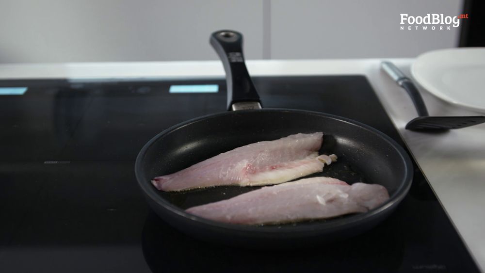 Cooking sea bass with skin face down in a skillet from FoodBlog Marvin's Five