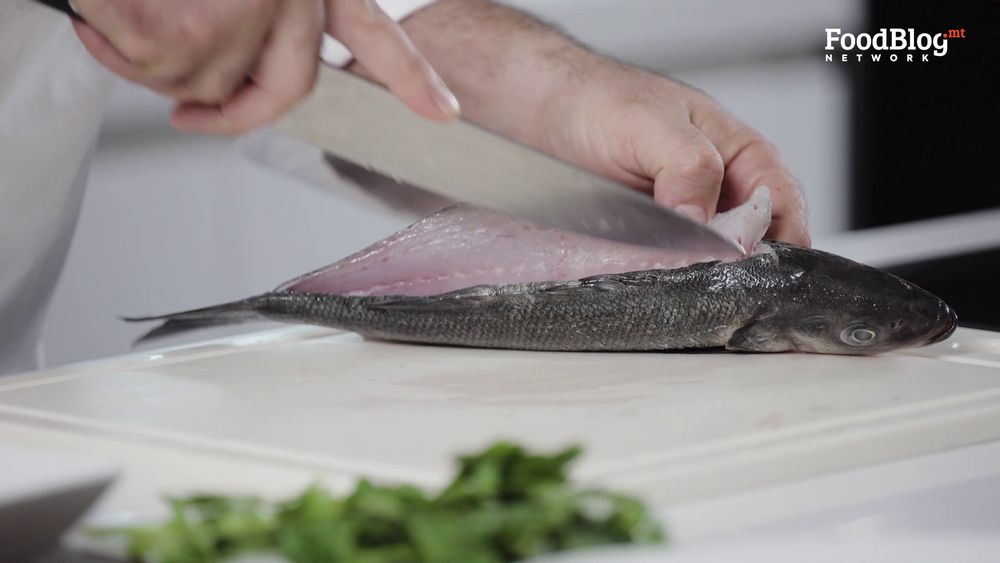 Marvin Gauci fileting the sea bass with a sharp knife from FoodBlog Marvin's Five