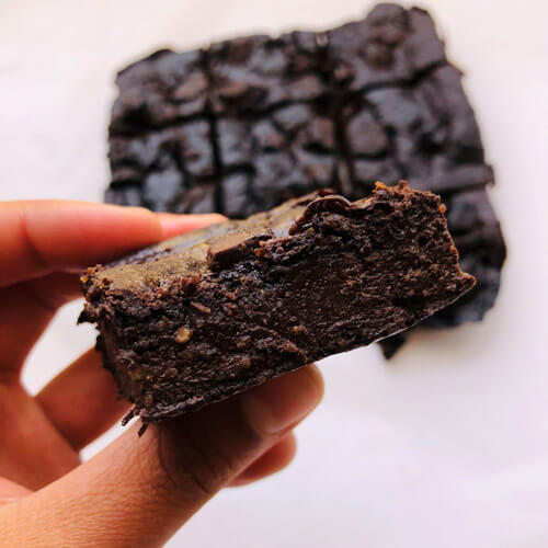 A cross section of the chocolate chip brownie ready to be eaten