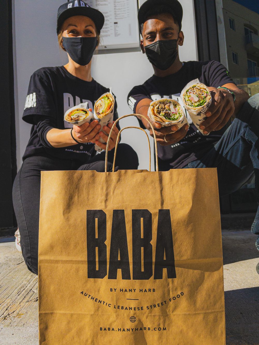 BABA Sandweesh + BABA branded take away bag and employees.