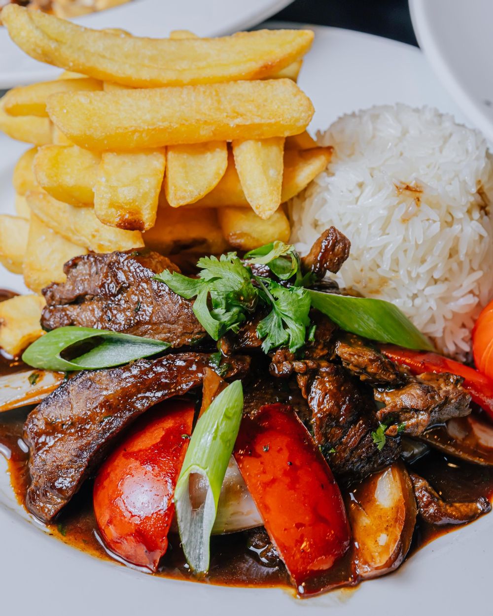 Peruvian style steak and chips dish