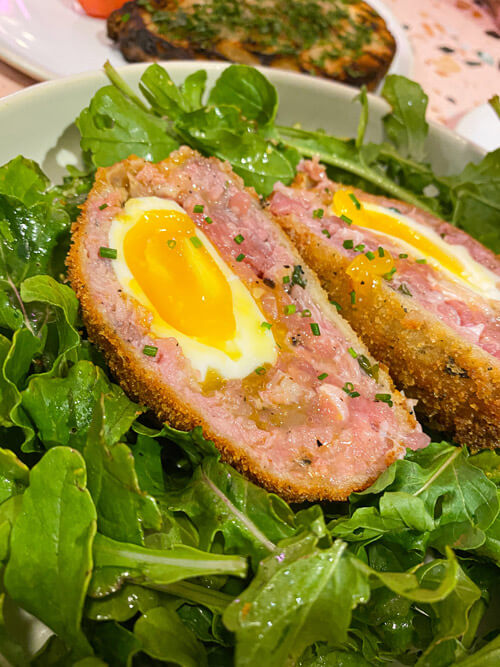  Maltese Sausage Scotch Eggs from Barbajean Malta, on a bed of greens