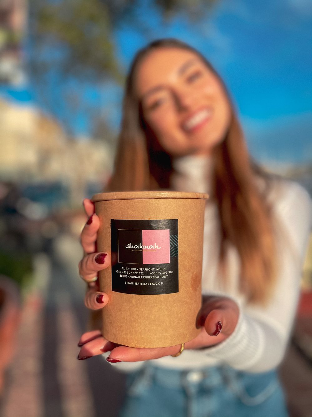 mixa gambin holding a kraft soup tub from shakinah with foodblog-malta