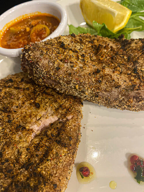 Three peppercorn encrusted fresh tuna steak at Pierre's Marsalforn