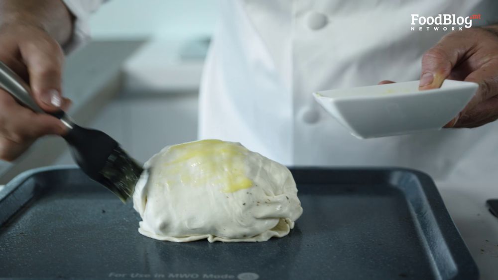 Wrap up your filled with puff pastry, cover in butter and it's ready for the oven!