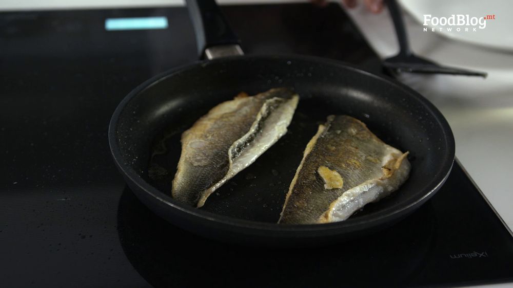 Flipping the skin face up to seal in the fish flavours from FoodBlog Marvin's Five